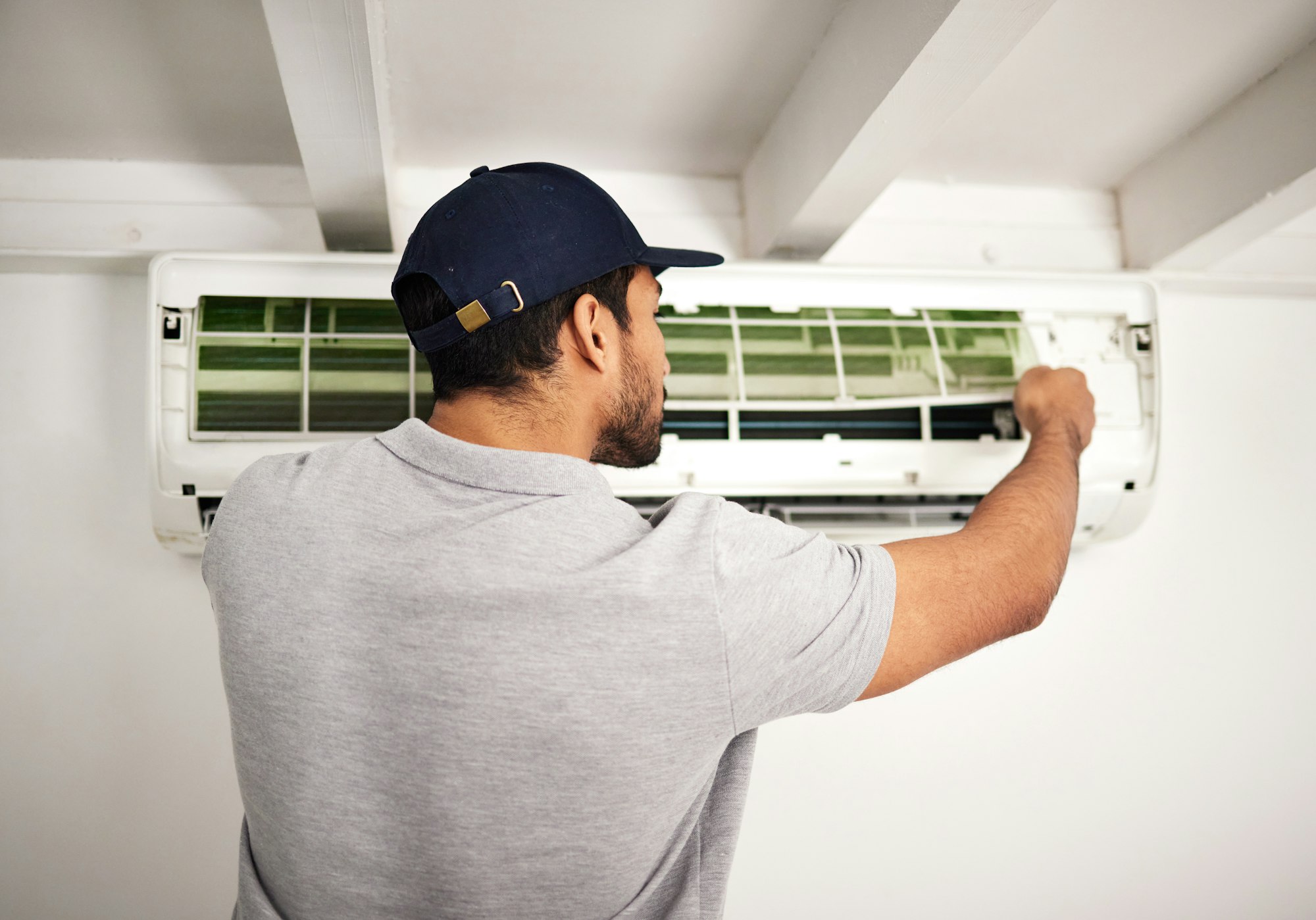 Maintenance service, air conditioner technician and man, working on ventilation filter or ac repair